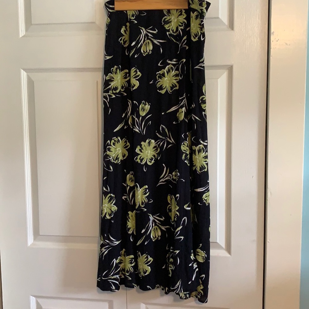 Lightweight flowing skirt has split in front.